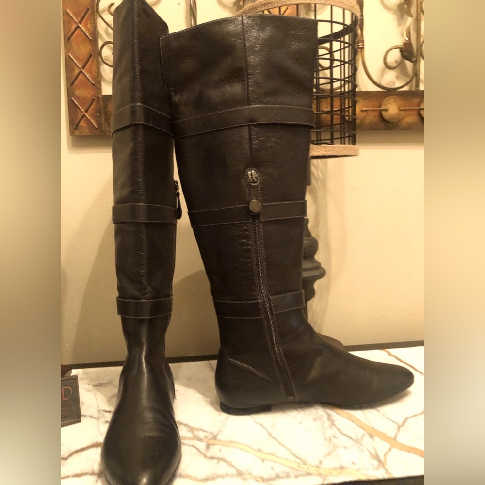 Black over the knee riding boots; with white stitching detail; inside 1/2 zip